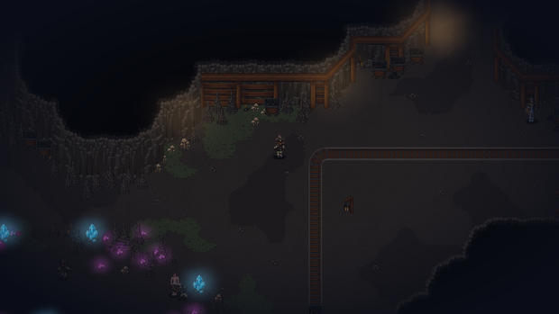 A character in the dwarven mining caverns among glowing crystals and ore carts